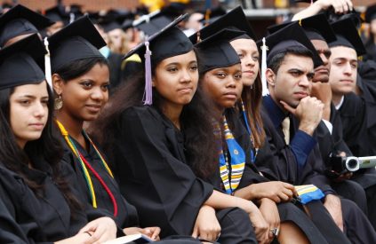 Graduating students listen to U.S. President Barack Obama speak at the University of Michigan commencement ceremony in Ann Arbor